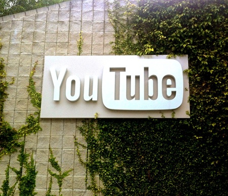 YouTube hanging on ivy covered wall at YouTube HQ in San Bruno CA 
