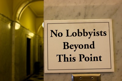 A sign inside statehouse reads: "No lobbyists beyond this point"