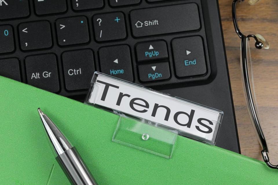 A computer keyboard shows the control shift alt buttons with a green folder on top with a label that reads "Trends"
