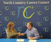 VCBB Executive Director Christine Hallquist shaking hands 