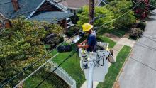 EC Fiber man in bucket truck aerial view over home