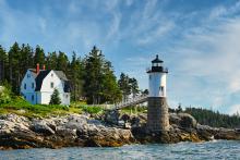 A lighthouse on the rocky shores of Isle au Haut Maine